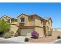Charming home with a two-car garage and beautiful landscaping on a sunny day at 10650 Little Horse Creek Ave, Las Vegas, NV 89129