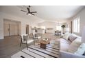 Spacious open-concept living room with modern furniture and lots of natural light at 10712 Aire Dr, Las Vegas, NV 89144