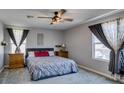 Cozy bedroom with a ceiling fan and lots of natural light at 1130 E Dorrell Ln, North Las Vegas, NV 89086