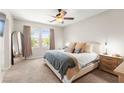 Serene main bedroom with large windows, neutral tones, and plush carpet at 11402 Newton Commons Dr # 102, Las Vegas, NV 89135