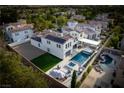 Gorgeous property with a large pool, solar panels, and outdoor seating areas from above at 11830 Kingsbarns Ct, Las Vegas, NV 89141