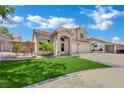 Beautiful two-story house with manicured lawn and inviting curb appeal on a sunny day at 1335 Passiflora Dr, Henderson, NV 89002