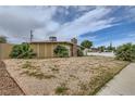 Single story home with desert landscaping and a stone chimney at 1607 Vegas Valley Dr, Las Vegas, NV 89169