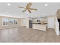 Open-concept living area featuring tile floors, recessed lighting, and seamless flow into the kitchen at 3064 Bicentennial Pkwy, Henderson, NV 89044