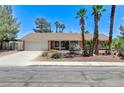 Charming single story home featuring a spacious driveway and xeriscaped front yard at 3360 Paso Andres St, Las Vegas, NV 89146