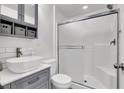 Modern bathroom with white subway tile and a vessel sink on a vanity at 382 Gracious Way, Henderson, NV 89011