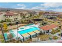 Inviting community pool area features lounge chairs, shaded pergola, and adjacent spa at 4 Lomita Heights Dr, Las Vegas, NV 89138