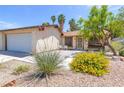 Charming single story house with well-kept desert rock front yard at 4916 Carmichael Ave, Las Vegas, NV 89110
