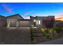 Charming single-story home with a three-car garage and landscaped entrance under a vibrant sunset at 5166 Stone View Dr, Las Vegas, NV 89135