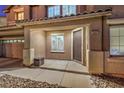 Covered porch with well-maintained hardscape that leads to front door at 5480 Oatfield St, North Las Vegas, NV 89081