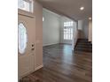 Inviting entryway featuring new light wood flooring, high ceilings and stairway at 5509 Big Sky Ln, Las Vegas, NV 89149