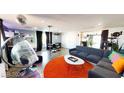 Open living room features modern furnishings, unique decor, and a disco ball at 5817 Rae Dr, Las Vegas, NV 89108