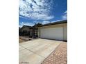 Attached two-car garage offering convenient parking and storage at 600 Woodmount Dr, Las Vegas, NV 89107