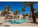 Resort style pool area with palm trees and ample lounge seating at 7400 W Flamingo Rd # 1082, Las Vegas, NV 89147