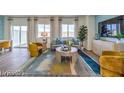 Bright living room showcasing modern furniture, large windows, and stylish decor at 7915 Pandora Sky St # 402, North Las Vegas, NV 89084