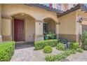 Inviting front porch with brick pavers and neat landscaping at 9192 Moose Country Pl, Las Vegas, NV 89178