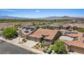 Beautiful aerial view of a desert home showcases the tile roof and low-maintenance desert landscaping at 1008 New Creek Ave, Henderson, NV 89015