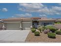 Well-maintained home with xeriscape landscaping, three-car garage, and stone accents on the posts at 1008 New Creek Ave, Henderson, NV 89015