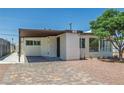 Attractive home featuring a covered carport and desert landscaping at 1720 Eastwood Dr, Las Vegas, NV 89104