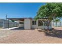 Inviting home with desert landscaping and a covered carport at 1720 Eastwood Dr, Las Vegas, NV 89104