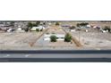 Aerial view of a single story home with large yard and front fence at 2440 Homestead Rd, Pahrump, NV 89048