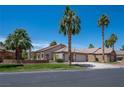 Attractive single-story home with well-maintained landscaping and a spacious driveway and desert setting at 2505 Links Dr, Laughlin, NV 89029