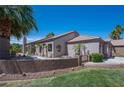 A Southwestern-style home with desert landscaping and a walled courtyard, showcasing outdoor charm at 2505 Links Dr, Laughlin, NV 89029