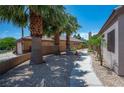 A charming walkway lined with desert landscaping leads to this lovely home and garage at 2505 Links Dr, Laughlin, NV 89029