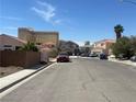 Neighborhood street view showcasing the surrounding homes in a residential area at 2694 Hillgrass Rd, Las Vegas, NV 89123