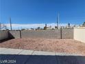 Spacious backyard featuring a concrete patio and low-maintenance desert landscaping at 2711 Morning Break Ct, Las Vegas, NV 89142