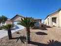 Charming single-story home featuring a two-car garage and desert landscaping at 2711 Morning Break Ct, Las Vegas, NV 89142