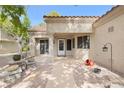 Inviting front porch with decorative elements and a welcoming entryway for a cozy curb appeal at 2836 Linkview Dr, Las Vegas, NV 89134