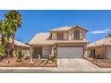 Two-story home with tile roof, palm trees, well-maintained landscaping, and a two-car garage at 3440 Meridale Dr, Las Vegas, NV 89117
