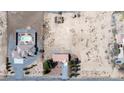 Expansive aerial view showcasing a desert property with a main house and a separate pool house at 480 China St, Pahrump, NV 89048