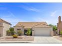 Attractive single-story home with a well-maintained front yard and a spacious driveway leading to a two-car garage at 538 Ancient Mayan Dr, Henderson, NV 89015