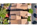 Aerial view showcasing the home's roof, backyard patio, and surrounding neighborhood at 602 Painted Cloud Pl, Las Vegas, NV 89144