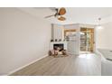 Bright living room featuring a fireplace and sliding glass doors that open to a private balcony at 7155 S Durango Dr # 309, Las Vegas, NV 89113