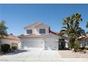 Charming two-story home with a three-car garage and well-manicured landscaping at 7825 Desert Bell Ave, Las Vegas, NV 89128