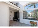 Inviting front entrance with large windows and a well-maintained walkway at 7825 Desert Bell Ave, Las Vegas, NV 89128