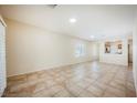 Spacious living room with tile flooring and lots of natural light at 7957 Fantail Dr, North Las Vegas, NV 89084