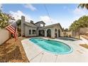 Backyard with a sparkling pool and spa, perfect for outdoor entertaining at 823 Schooner Dr, Henderson, NV 89015