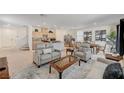 Bright living space with an open layout, neutral furniture, stylish decor, and lots of natural light at 8786 Sand Verbena Ave, Las Vegas, NV 89117