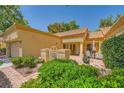 Charming single-story home with a private front patio, manicured landscaping, and a terracotta tile roof at 9024 Starmount Dr, Las Vegas, NV 89134
