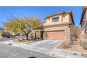 Charming two-story home featuring a stone facade, attached garage, and well-maintained landscaping at 10212 Cider Mill Rd, Las Vegas, NV 89135