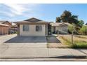 Inviting single-Gathering home with a long driveway and a fenced front yard, perfect for a Gathering at 1105 Declaration Dr, Las Vegas, NV 89110