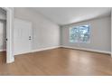 Bright bedroom with large window and hardwood flooring at 1150 N Buffalo Dr # 2025, Las Vegas, NV 89128