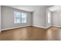 Open concept living room offers sleek hardwood floors and plenty of natural light at 1150 N Buffalo Dr # 2025, Las Vegas, NV 89128