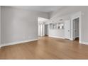 Spacious living room featuring hardwood floors and an open view to the kitchen at 1150 N Buffalo Dr # 2025, Las Vegas, NV 89128