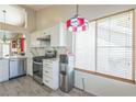 Kitchen featuring stainless steel appliances, light wood floors, and ample natural light at 169 Alterra Dr, Henderson, NV 89074