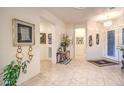 Bright foyer with tile flooring, chandelier, and decor, welcoming you inside the home at 1809 Prichard Ave, Henderson, NV 89052